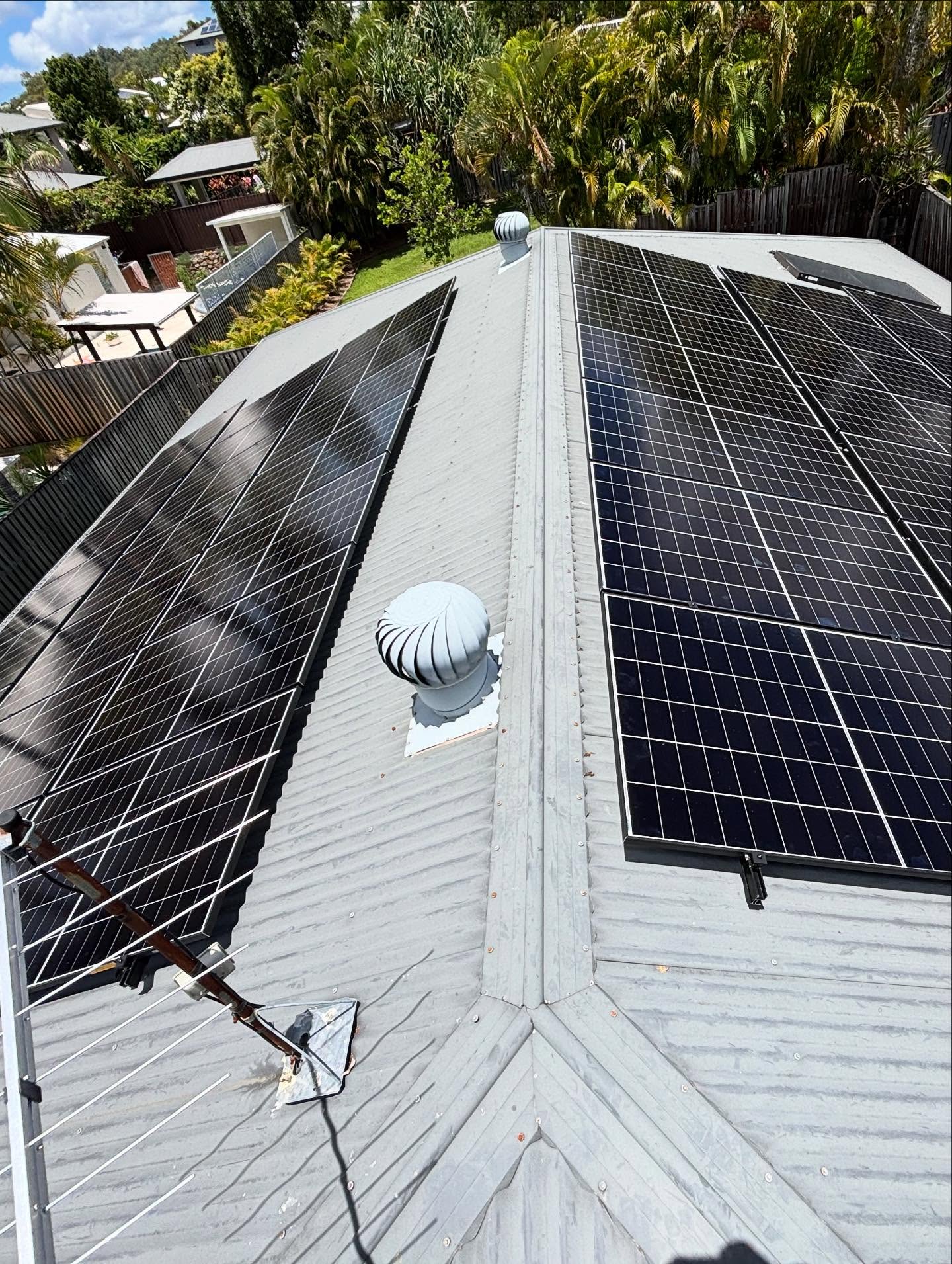 Solar panels on both sides of roof ridge